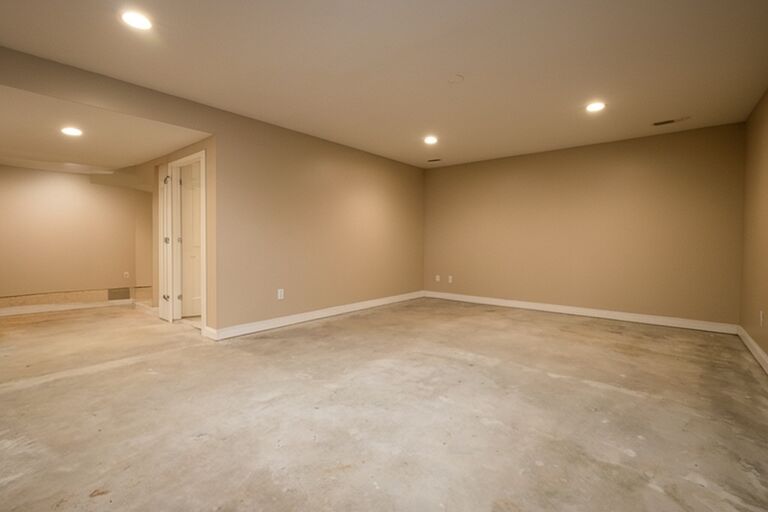 Clean organized empty basement after complete cleanout in a Staten Island home